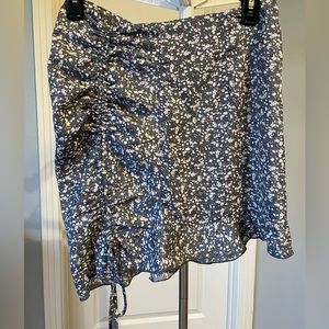 Blue floral ruched side body con skirt